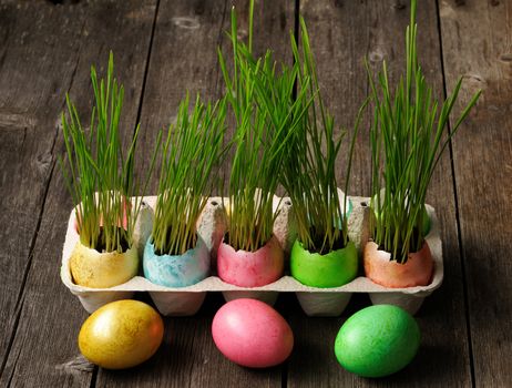 Colored easter eggs on wooden table