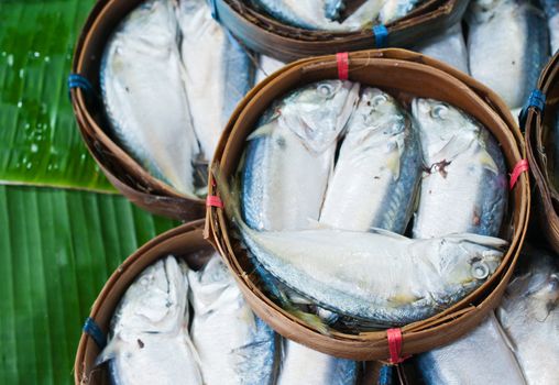 Mackerel fish in bamboo basket at market, Thailand