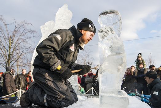 LONDON, UK - JANUARY 13: Artists compete in the freestyle category at the London Ice Sculpture Festival, in Canary Wharf. January 13, 2013 in London.