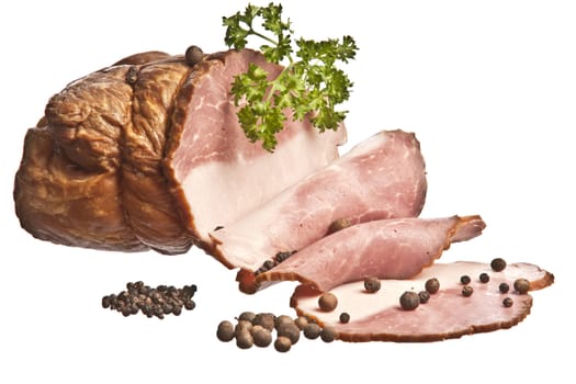 The boiled pork decorated by pepper and a parsley on a white background