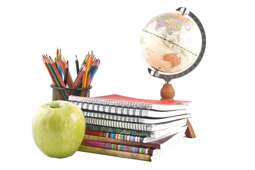 Globe, notebook stack and pencils. Schoolchild and student studies accessories. Back to school concept.