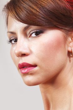 closeup of beautiful face with makeup, cheerful glance