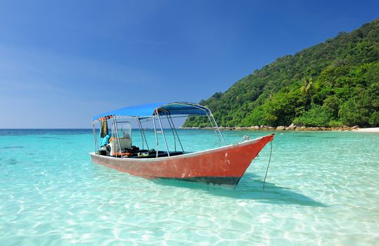 Beautiful beach with motor boat at Perhentian islands, Malaysia