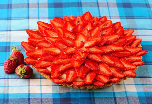 Homemade strawberry tart on table