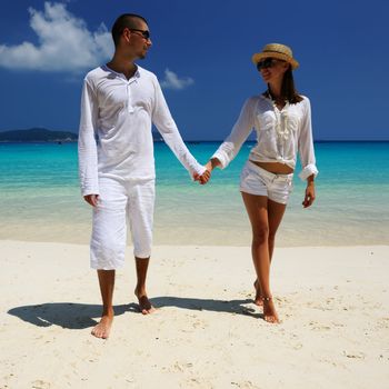 Couple in white on a tropical beach