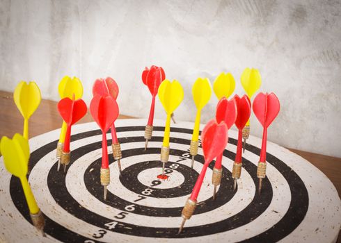 Success concept, darts hit target on dartboard