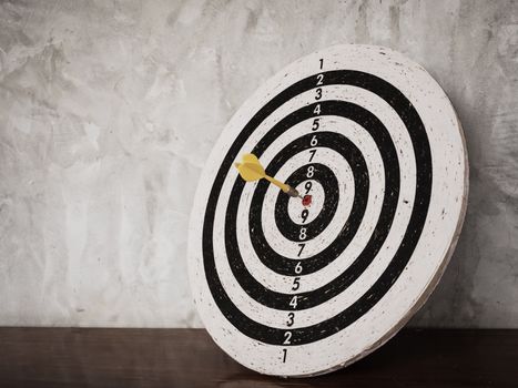 Success concept, darts hit target on dartboard