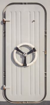 Handle of white ship door