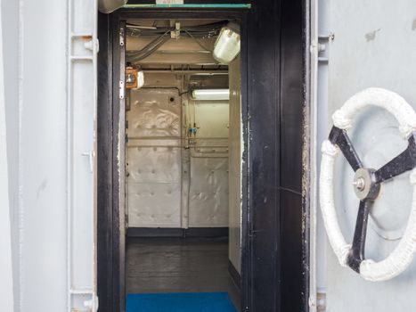 Handle of white ship door open inside