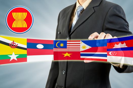 ASEAN Economic Community in businessman hand