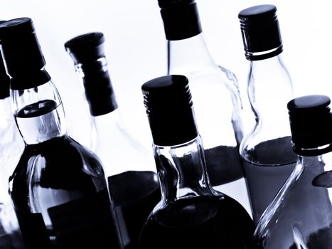 Various bottles at a bar, black and white, high contrast