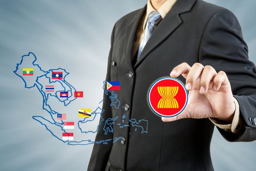 ASEAN Economic Community in businessman hand