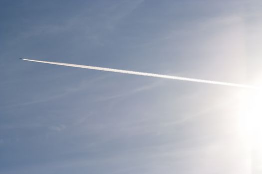 Shot of the flying air plane on blue sky