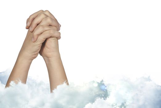 Praying woman hands with mystic holly clouds