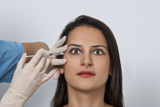 Cosmetic botox injection in the female face