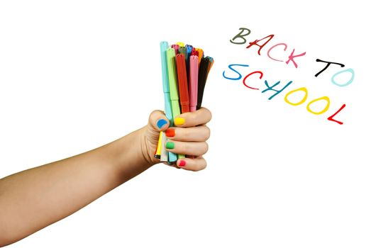 Colorful markers in hand, isolated on white.