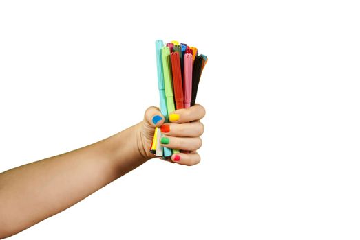 Colorful markers in hand, isolated on white.