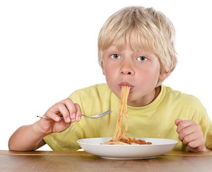 hungry blond boy eating spaghetti