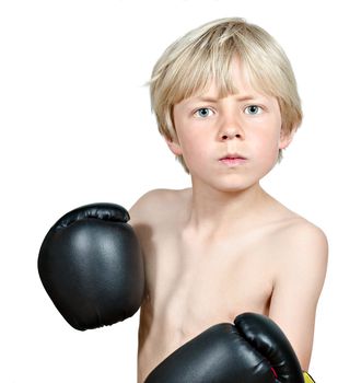 blond boy posing with black boxing gloves