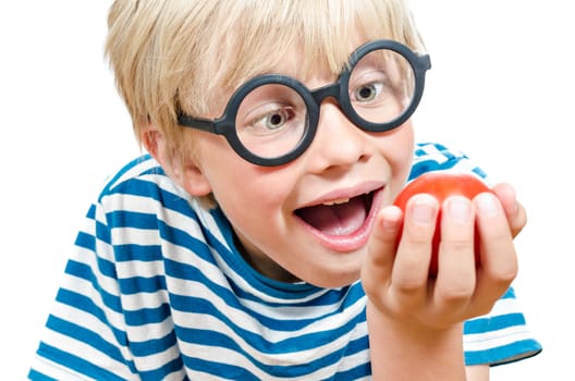 cute funny blond boy with tomato