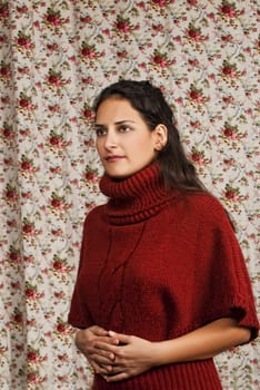 Woman in red over colorful floral background