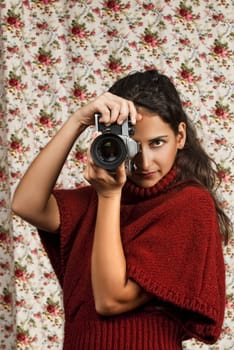 Woman in red over colorful floral background