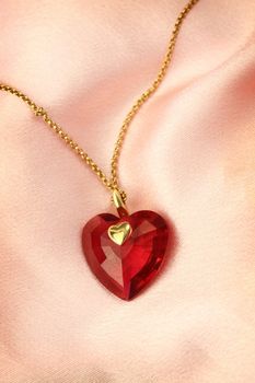  red gemstone crystal , shape of a heart 