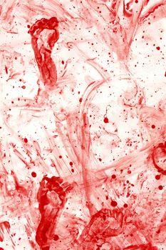 Photo of a mess of blood splatters, droplets, footprints and smears.
