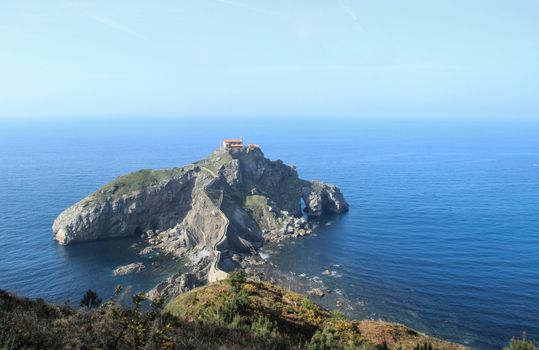 Panoramic view of Bizkaia coast, with San Juan de Gaztelugatxe islet and his ancient hermitage, in Spain