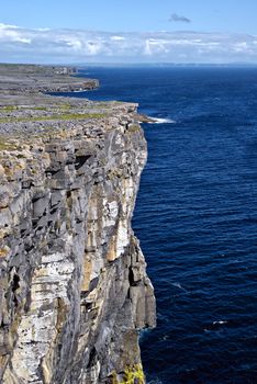 Overlooking the Atlantic ocean on the cliffs on Inishmore (Inis Mór), Aran Islands, Ireland next to Dun Aonghasa fort.