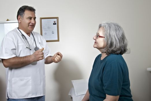 Male doctor talking with his patient