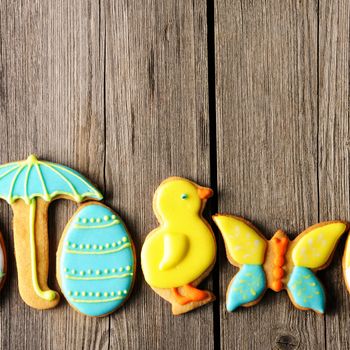 Easter homemade gingerbread cookie over wooden table