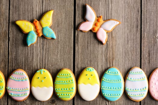Easter homemade gingerbread cookie over wooden table
