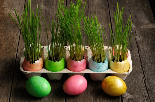 Colored easter eggs on wooden table