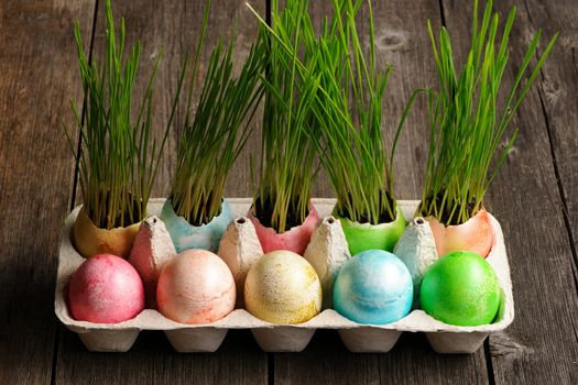 Colored easter eggs on wooden table