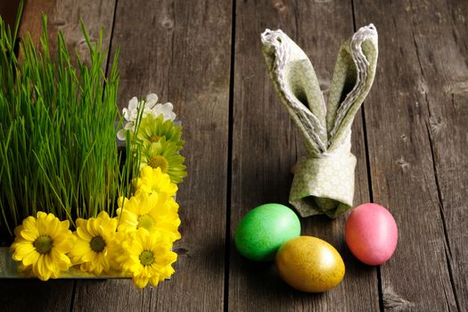 Colored easter eggs on wooden table