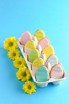 Easter homemade gingerbread cookie over blue