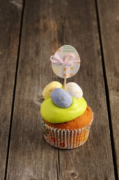 Easter homemade cupcake over wooden table