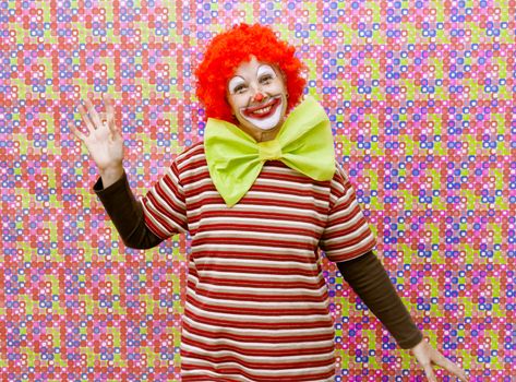Funny clown with makeup and party background color