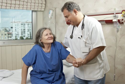 Hospital room doctor and patient