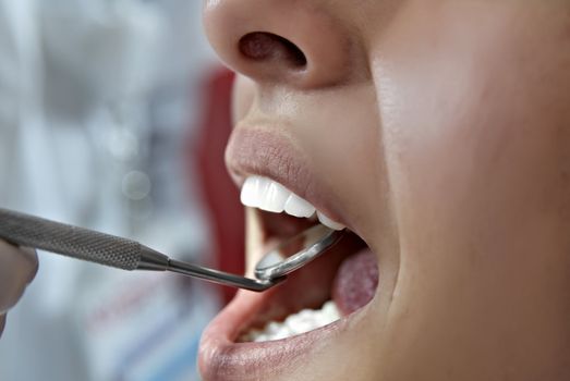 Dentist Examing Mouth