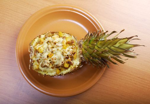 roast meat with cheese  grilled  in pineapple .closeup