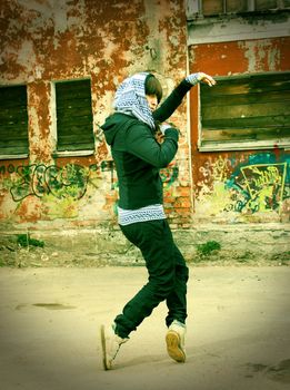 Hip hop female performing and act over an urban background  