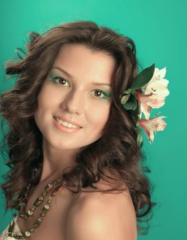 Portrait of beautiful girl with flowers in her hair 