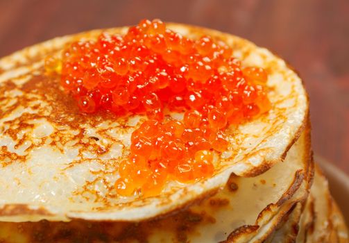 Traditional Russian pancakes  with red caviar