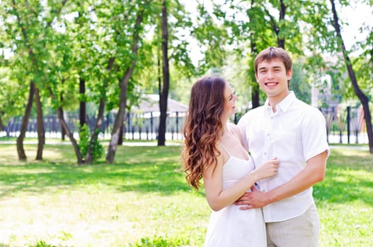 couple hugging in the park, have a good time together