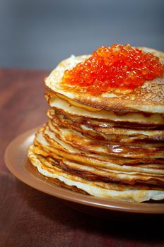 Traditional Russian pancakes  with red caviar