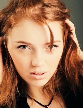 fashion portrait of a red hair sexy woman, studio shot 