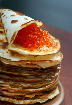 Traditional Russian pancakes  with red caviar