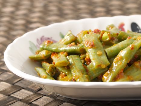 close up of a plate of stir fried long beans in chili shrimp paste